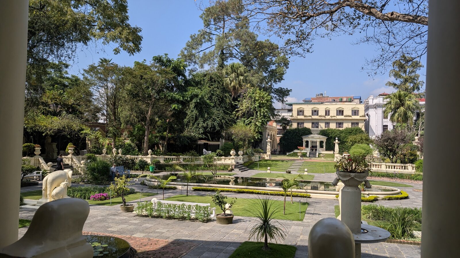 A formal garden with pavilions, fountains and balustrades beside the Kaiser Mahal