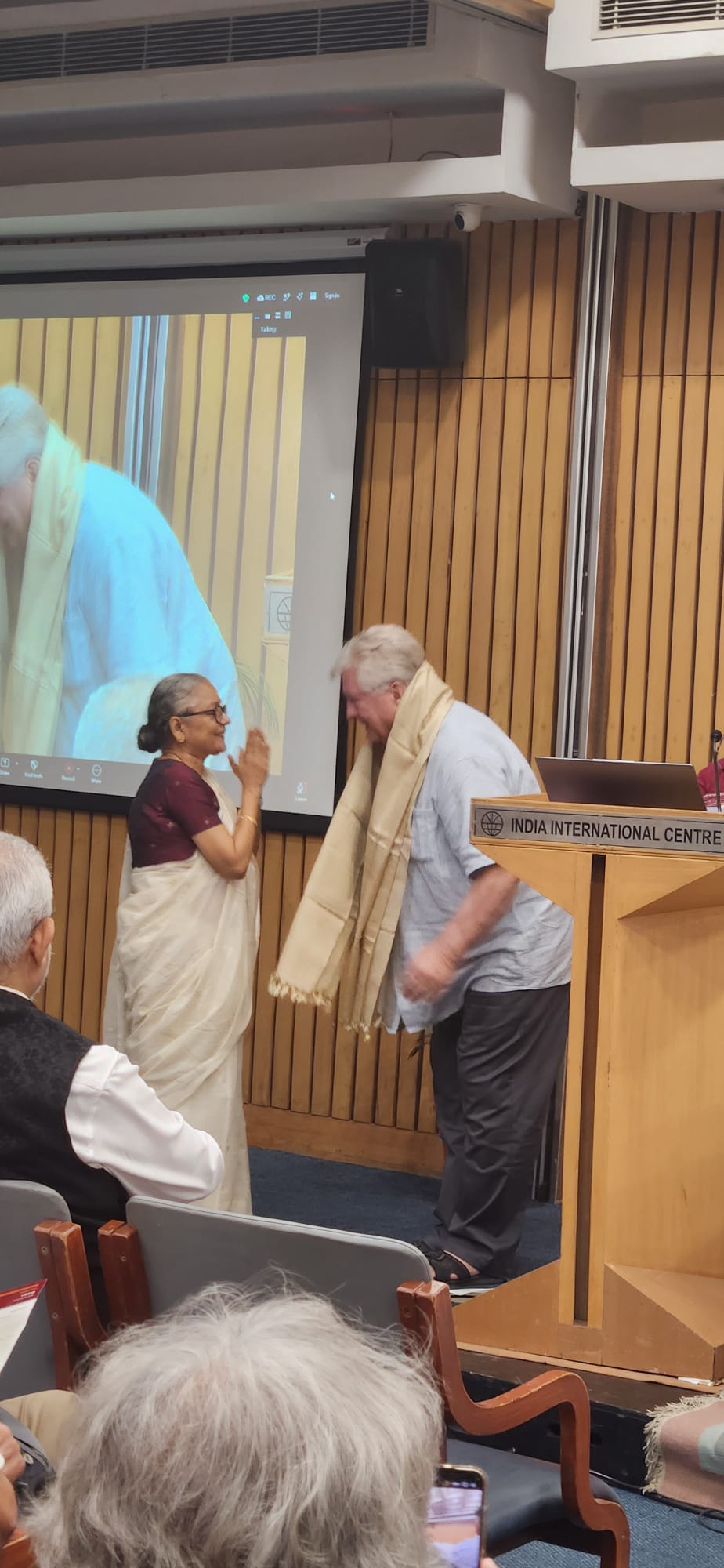 Dr Sudha Gopalakrishnan presenting Dominik Wujastyk with a shawl