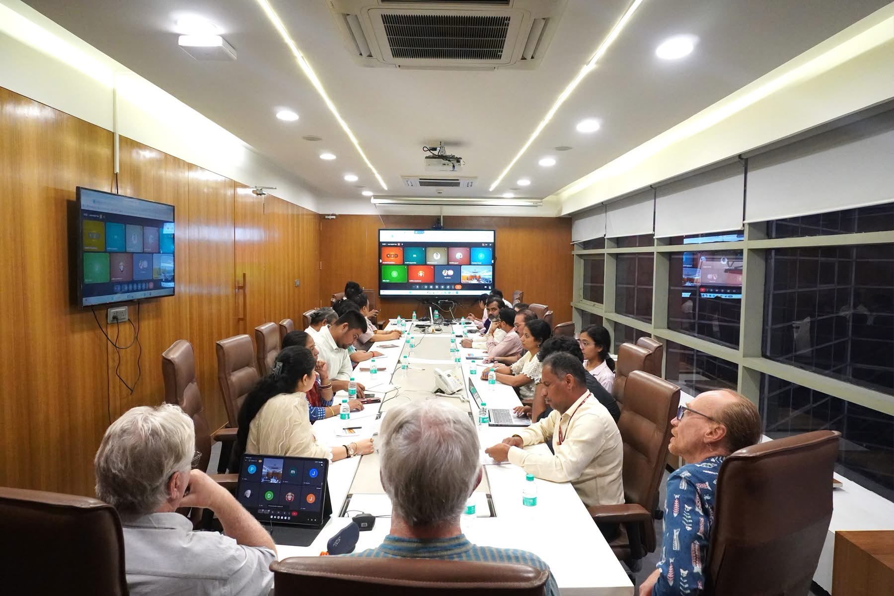 The round table in the Gyan Bharatam conference room, with online participants on screen