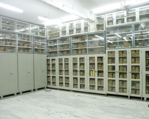 Glass-fronted cabinets of manuscripts in the museum library
